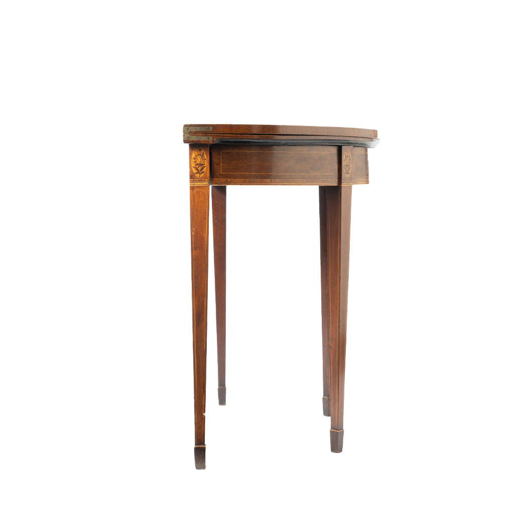 Side view of a compact wooden folding table with a rounded top, straight tapered legs, and delicate floral inlay accents on the corners. The warm wood finish and fine veneer detailing give the piece an elegant antique appearance.