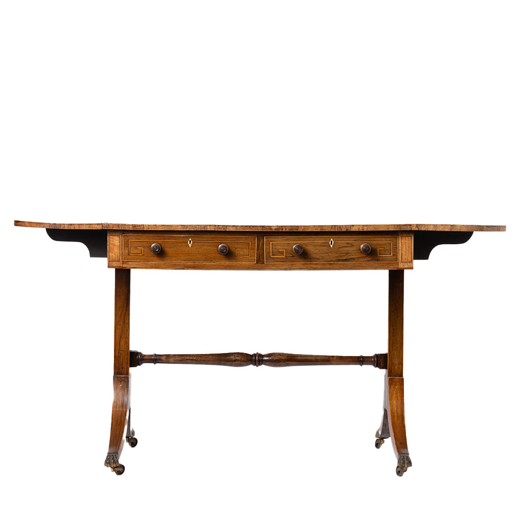 An antique wooden writing desk with two drawers, turned legs, and a central stretcher bar, shown against a plain white background.