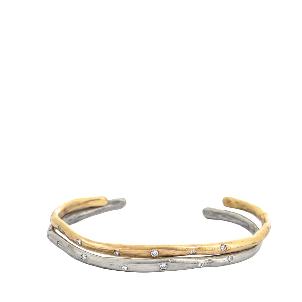 Two gold and silver bracelets stacked on a white background