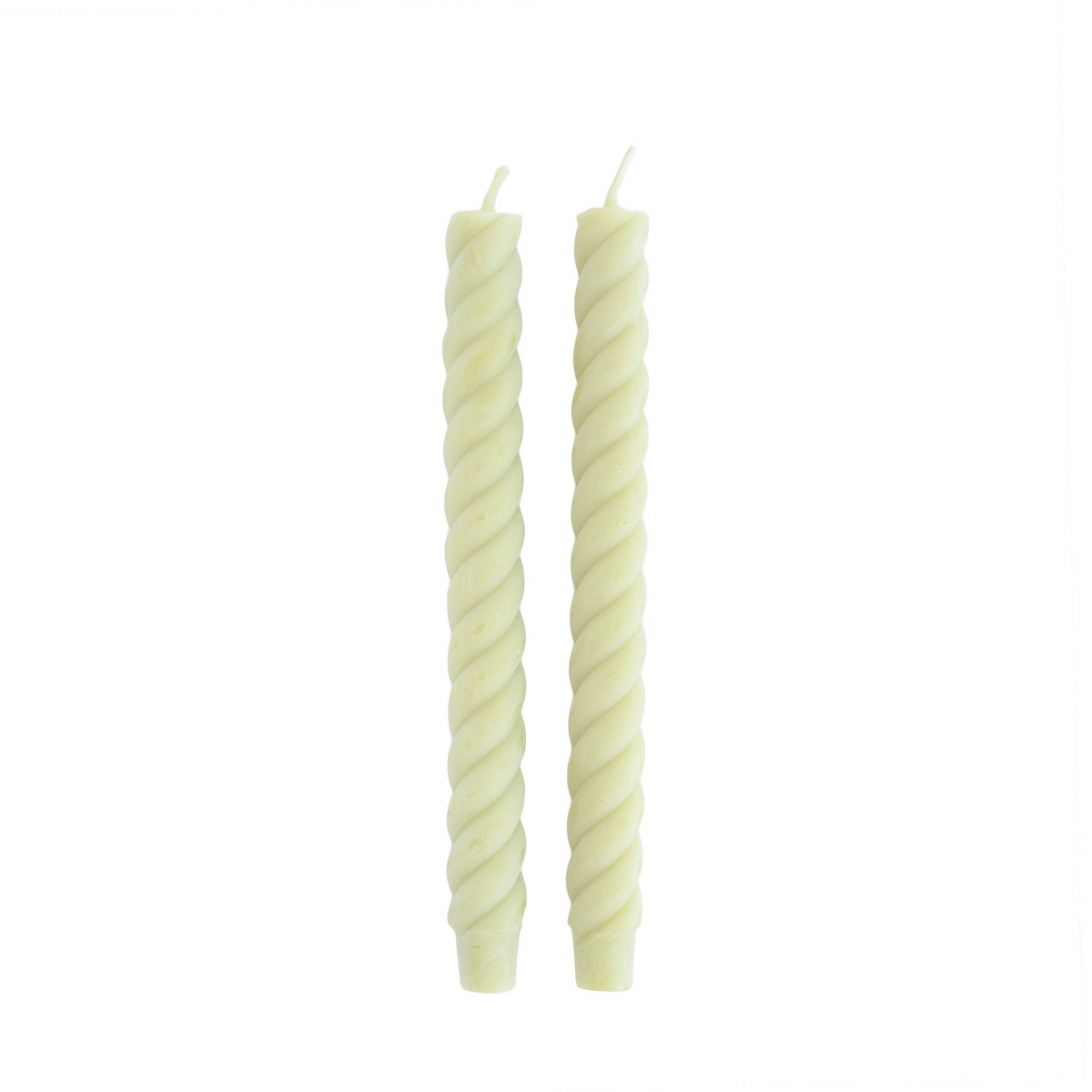 Two twisted green candles on a white background