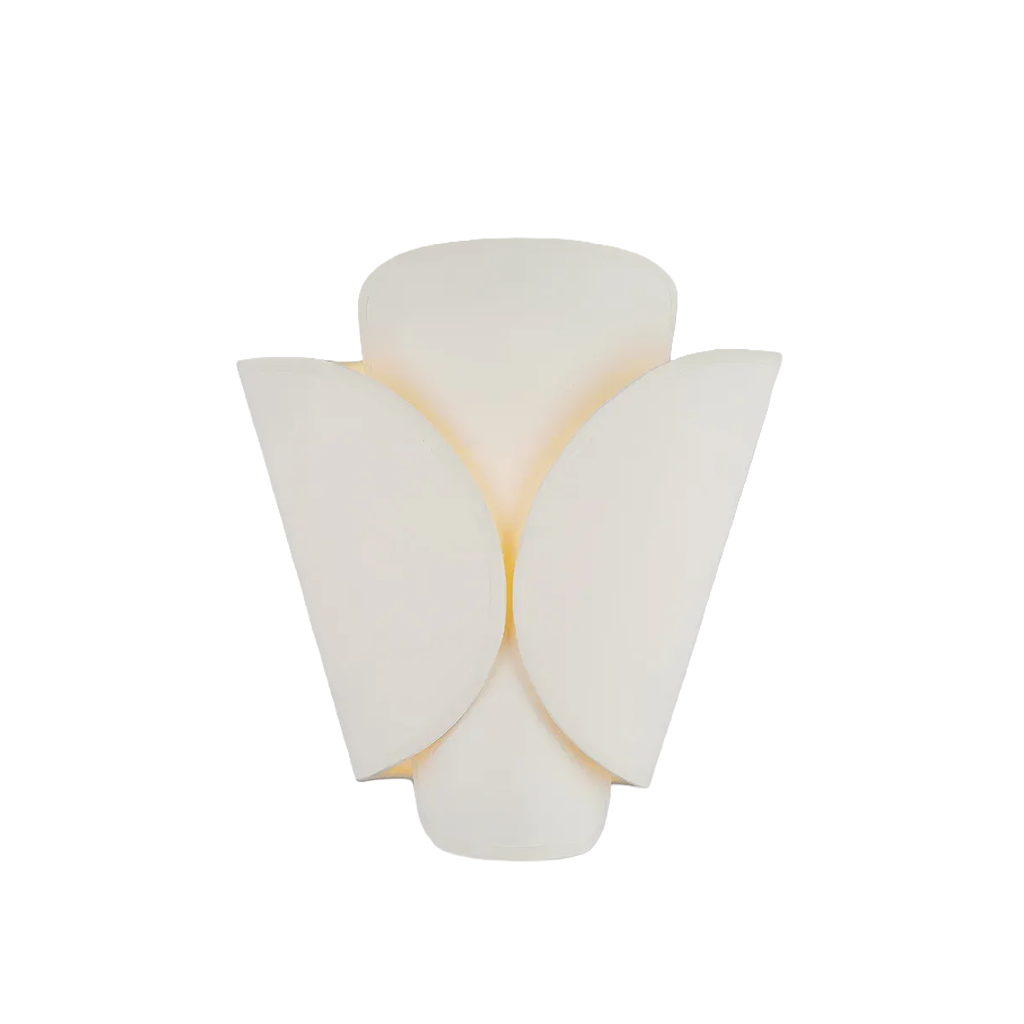 A modern wall sconce light fixture with a sculptural, layered petal-like design in a warm off-white or cream finish, casting a soft warm glow against a solid white background.