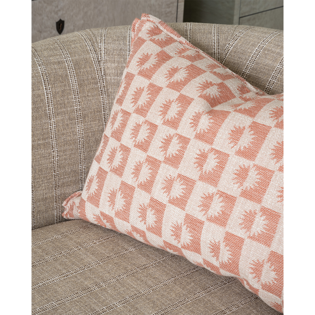 Checkered pillow on a gray chair