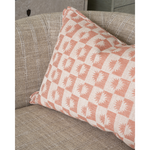 Checkered pillow on a gray chair