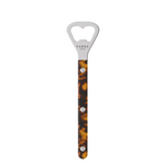 Bottle opener with tortoiseshell handle and silver top on a white background