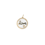 Round pendant with 'love' engraving on a white background