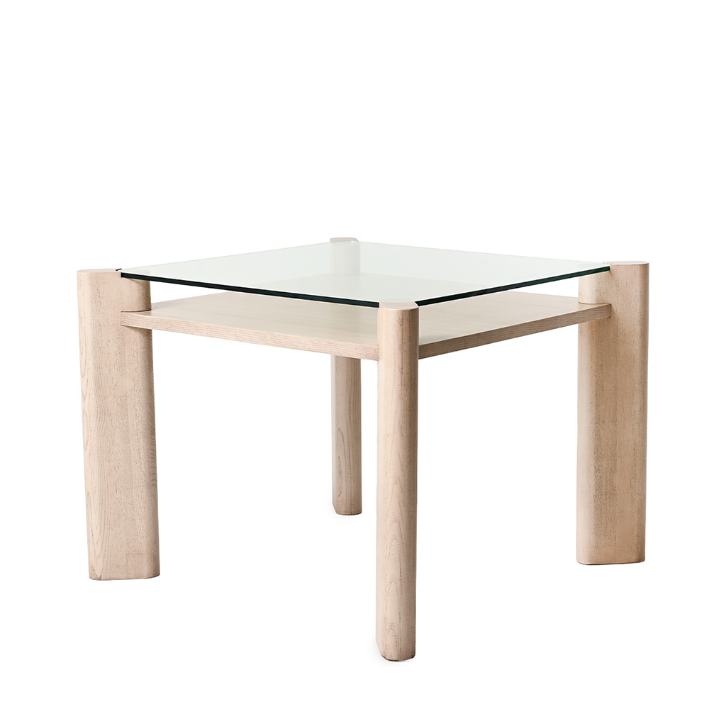 Square glass table with light wood legs on a white background