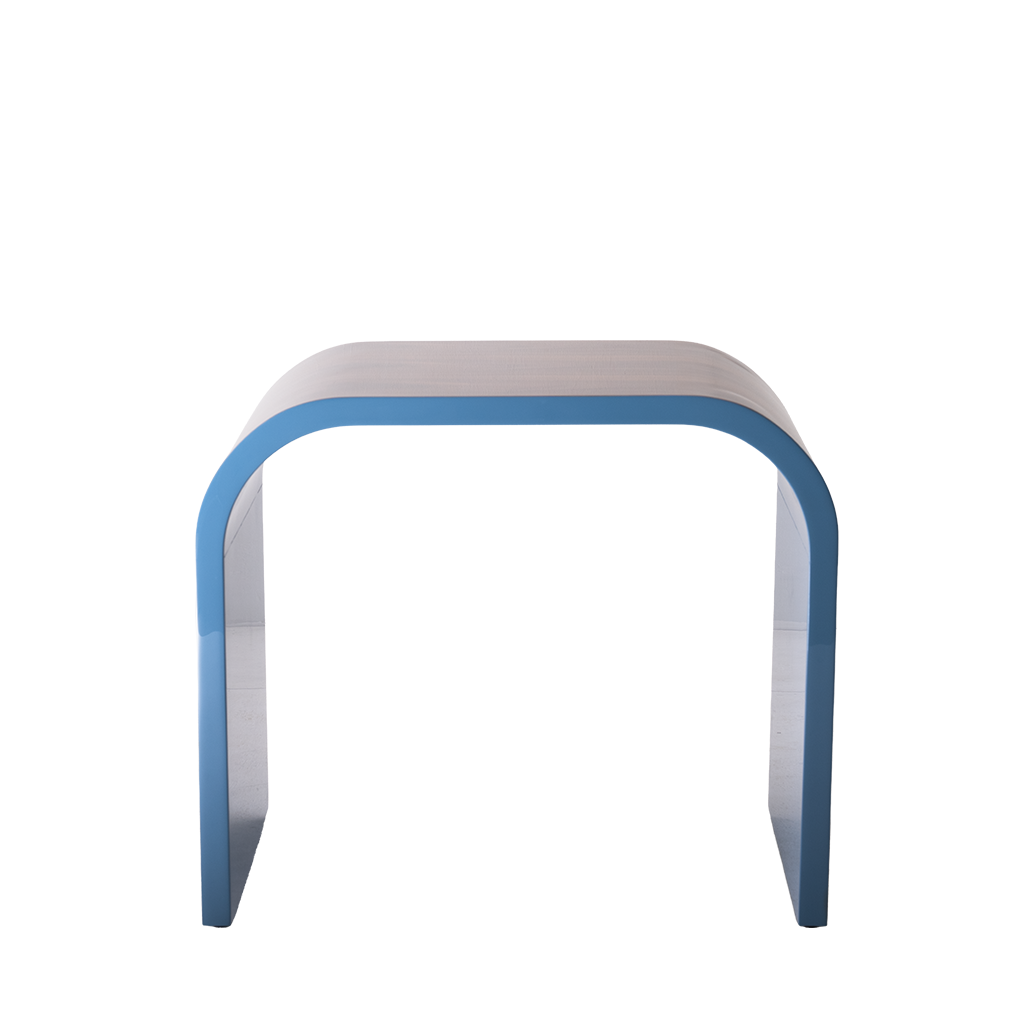 Modern side table with curved design on a white background