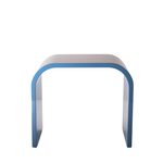 Modern side table with curved design on a white background