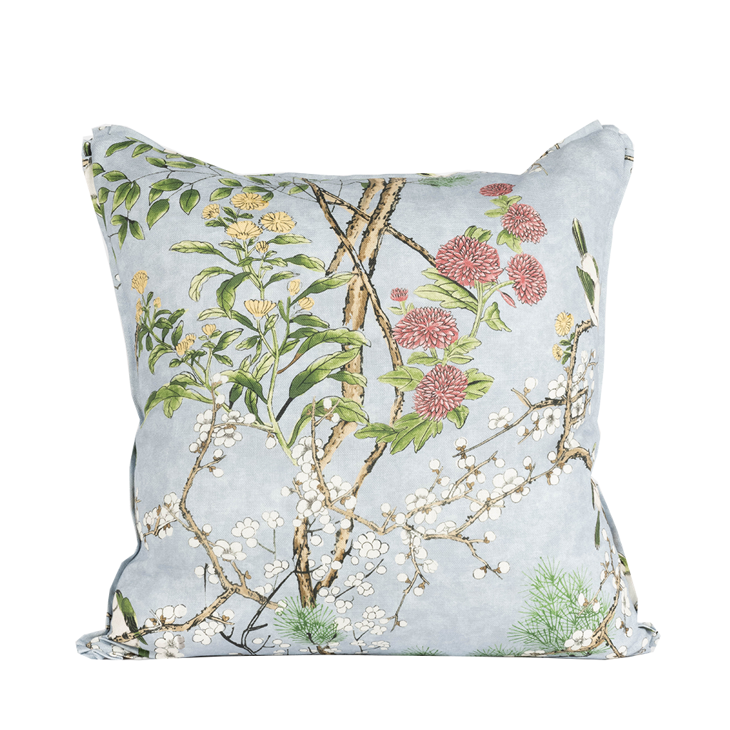 blue pillow with blue floral garden motif