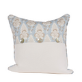 blue pillow with white and tan floral pattern
