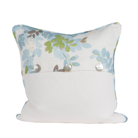 pillow with green and blue leaf motif