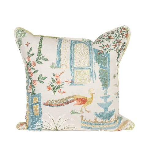 pillow with blue, green, red, and gold design featuring peacock in a garden