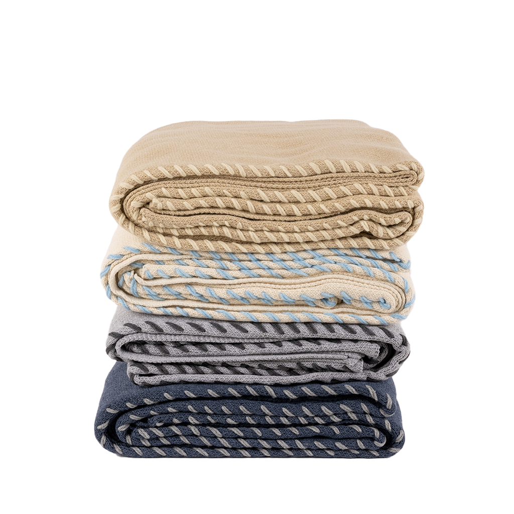 4 throw blankets stacked to show comparison in color ways