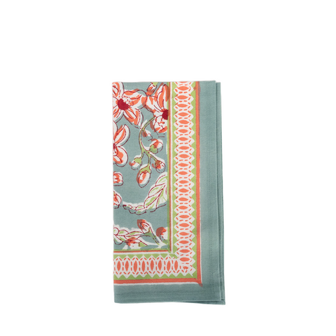 Block print napkin with blue green and pink floral pattern