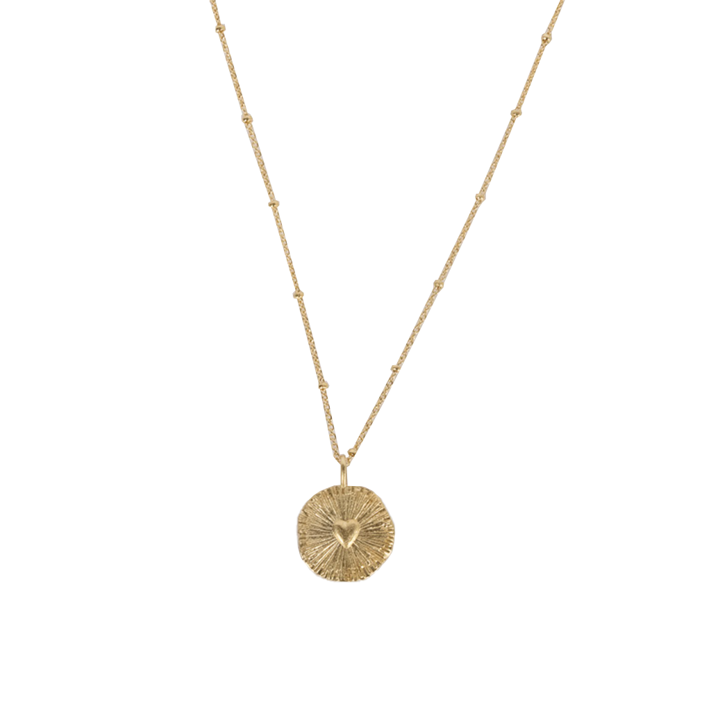 gold necklace with heart in center 