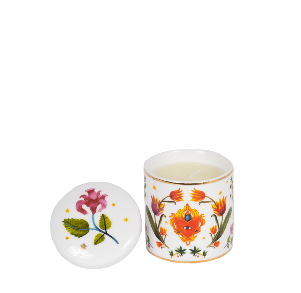 porcelain candle with floral motifs and gold rim, lid is off with floral motif