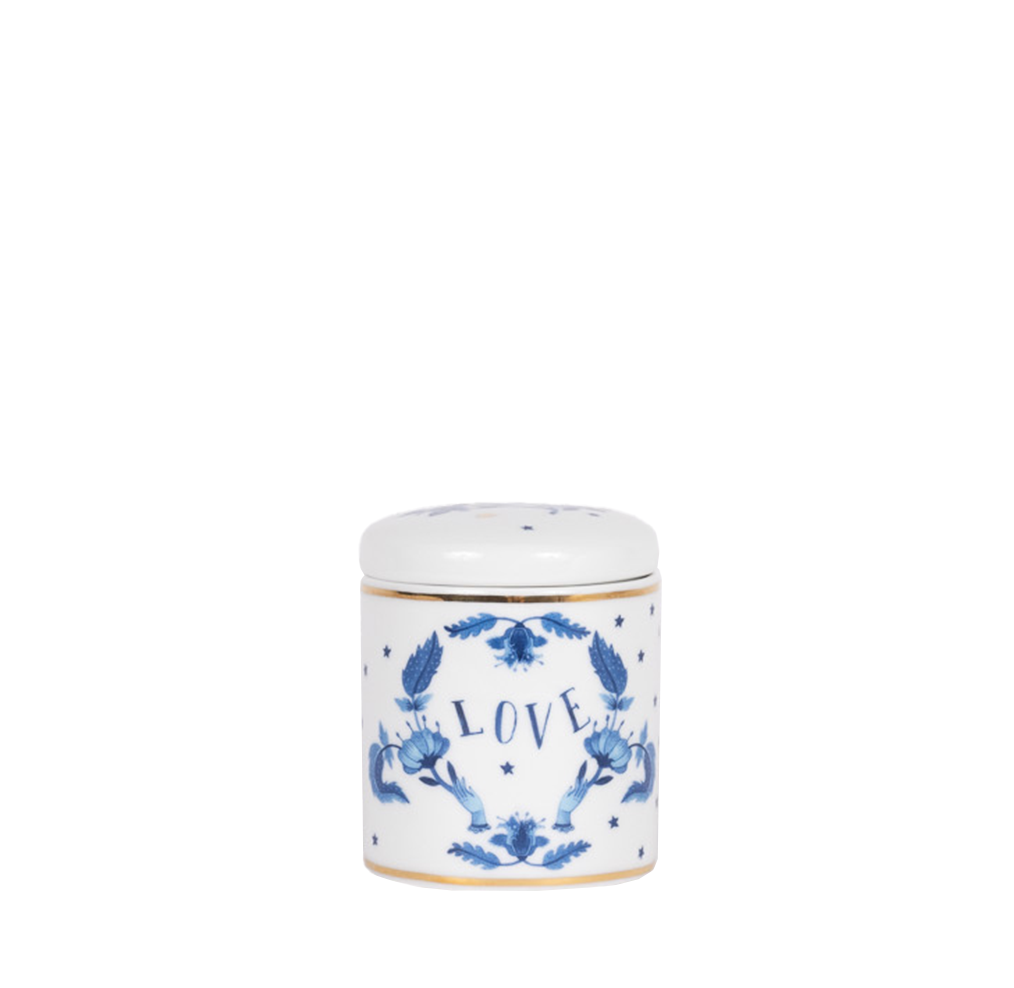 porcelain candle with blue motifs and the word "love"