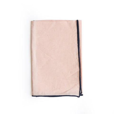 Folded view of Linen Colorblock Napkin, Blush with Navy Trim