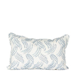 white lumbar pillow with light blue grass pattern