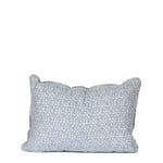 light blue pillow with repeating white sun pattern