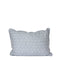 light blue pillow with repeating white sun pattern