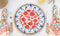 Hydra Dinner plate in cobalt on top of placemat with dessert plate, flatware and napkin