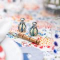 Individual Salt and Pepper Shaker Set in Blue displayed on tablecloth