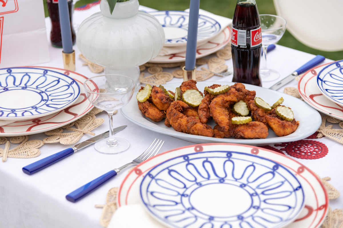 Juliska Quotidien White Truffle Large Oval Platter styled on red, white, and blue tablescape