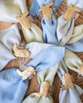Boot Lucite Napkin Rings displayed on various colored napkins