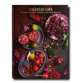 Chateau Life book cover featuring a photograph of fruit on a table
