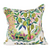 white pillow with colorful fruit and trees and flowers