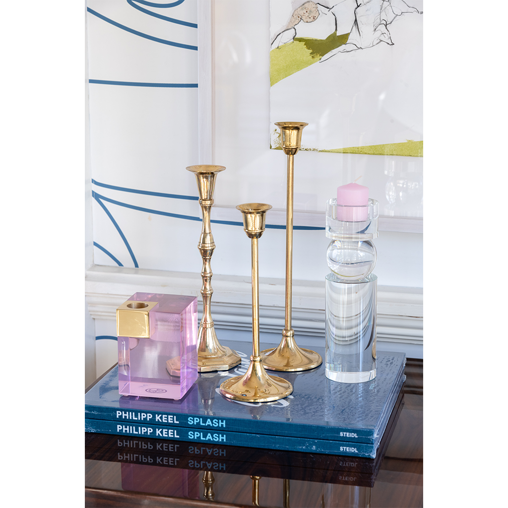 crystal pillar candle stick styled on top of coffee table books