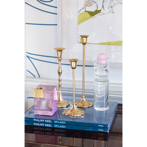 crystal pillar candle stick styled on top of coffee table books