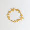 An All My Hearts bracelet laid flat in a circle on a white background