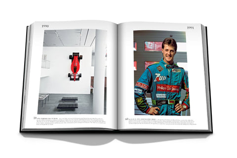 Formula 1: The Impossible Collection Book open showing photo of a car in the MOMA and a Formula 1 driver