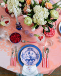 pink table setting pictured from above 