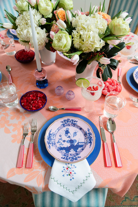 pink and blue dessert plate on table setting pictured from above