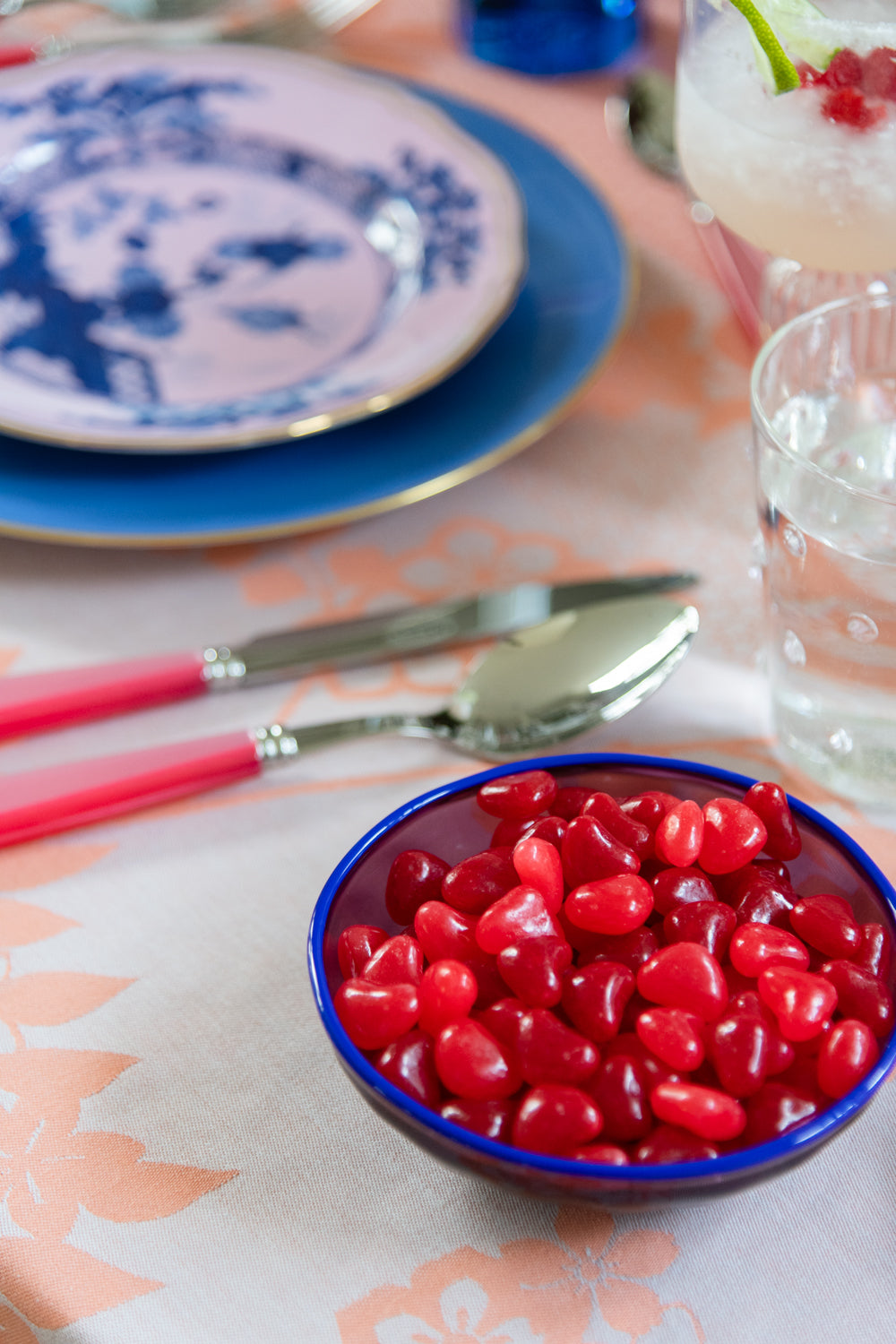 pink candies inside purple murano nut bowl 