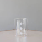 Three Tiered White Embellishment Tumbler on table