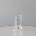 Three Tiered Green Embellishment Tumbler on table