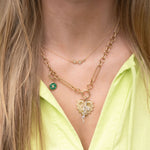 3 star gold necklace styled with necklace charms 