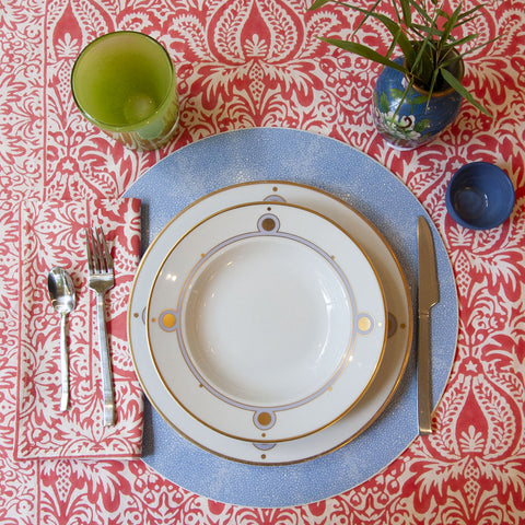 Cypress Coral Napkin displayed with matching tablecloth and tabletop place setting 