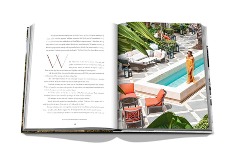 The Ocean Club book open featuring photograph of a pool and poolside lounge