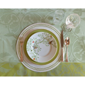 Olivia Dot Placemat in Chartreuse styled with dinner plate, dessert plate, flatware and glassware on top of tablecloth