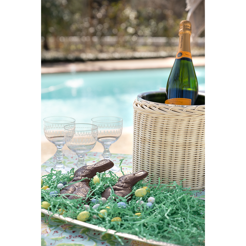 Woven Rattan ice bucket holding Vueve Champagne 