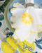 lemon embroidered napkin on a tablescape 