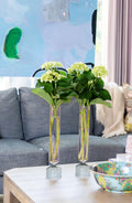 Clear Vase, Large with flowers displayed on coffee table in living room