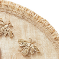 detail shot of handwoven straw bee placemat 