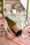 Christofle Vertigo Wine Server with bottle of wine inside, on table