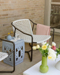 white rope outdoor chair on a set patio